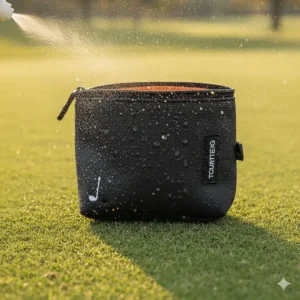 Demonstration of the water-resistant coating on the golf valuables pouch repelling water droplets.