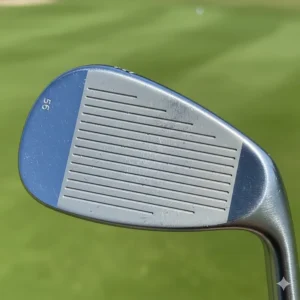 Close-up of aggressive milled grooves on a sand wedge face for maximum spin control.
