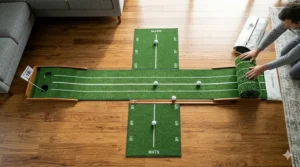 Top-down view of a putting mat featuring alignment lines and distance markers to improve stroke accuracy.