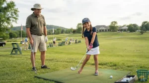 An instructor helping a young girl check her posture with beginner golf clubs for kids learning to play