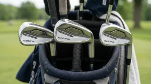 A close-up view of cavity-back irons included in a complete golf club set for beginners.