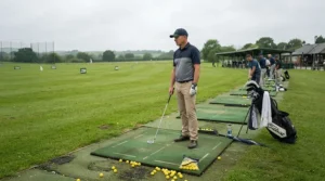 A focused player practicing their swing tempo with a golf driver for intermediate golfers at a local course.